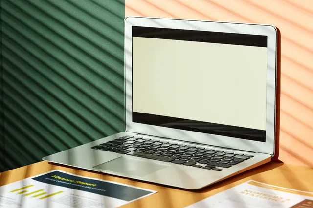 A sleek laptop on a desk with light and shadow play, ideal for tech and business themes. Prospecting software survey tools or panel data: which suits your England team?