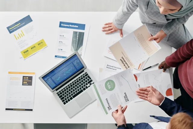 Top view of a professional office meeting with documents and laptop on the table. What prospecting software tools and providers mean for 2027 buying decisions